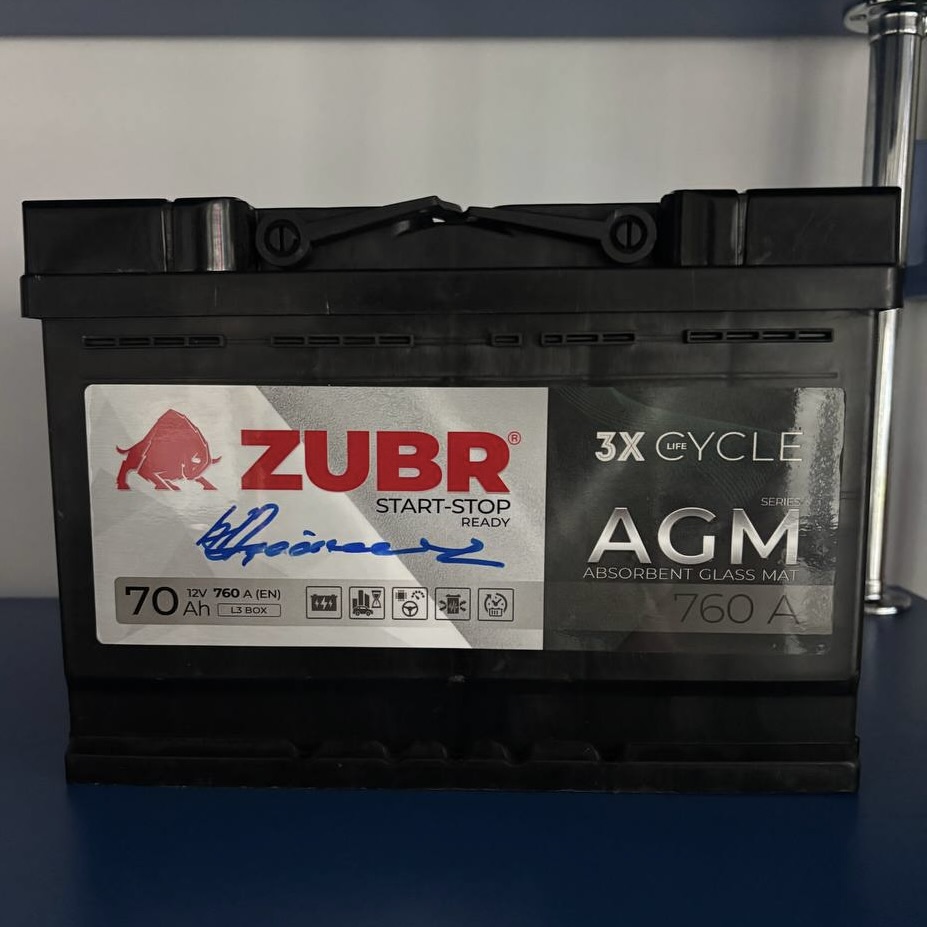 Pyotr Parkhomchik signing the first serial AGM battery produced by Zubr Energy LLC